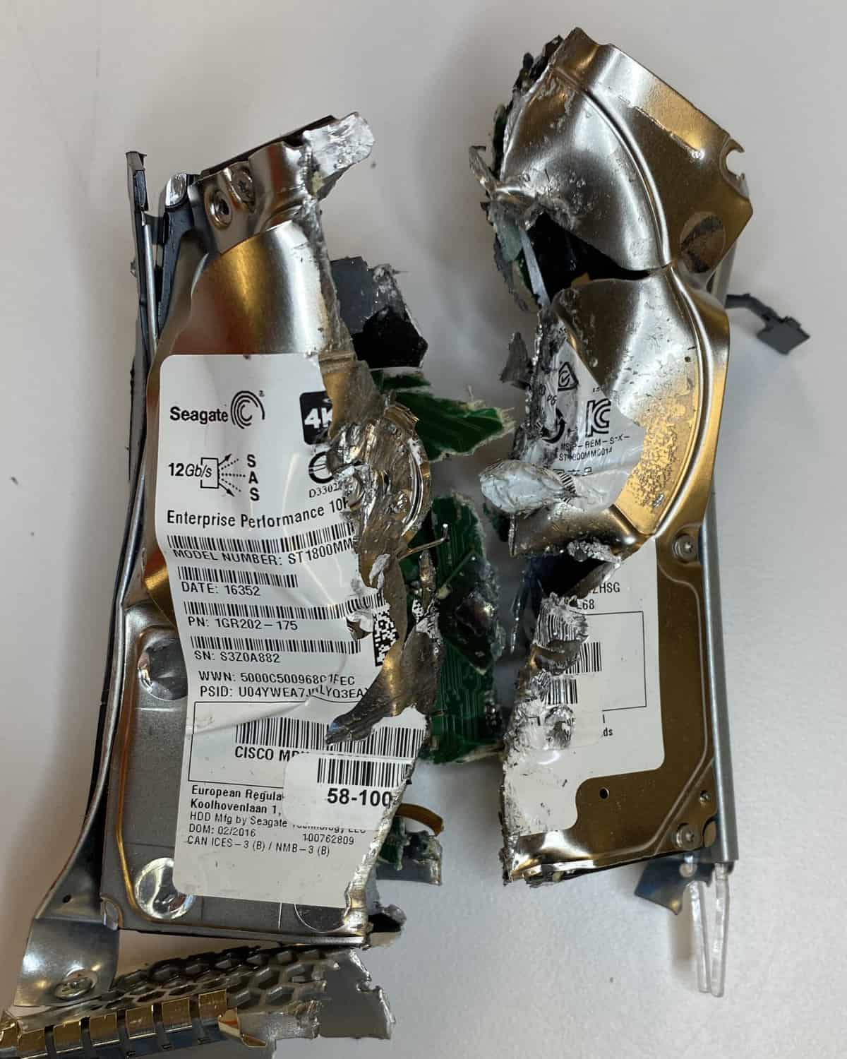 Shredded hard drive torn into half